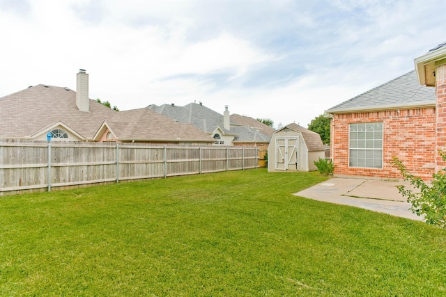 view of yard with a patio area and a shed