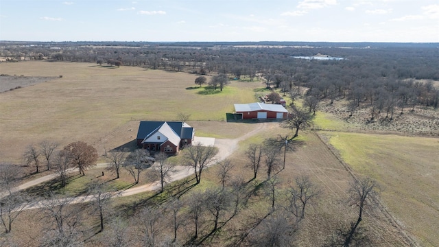 birds eye view of property with a rural view