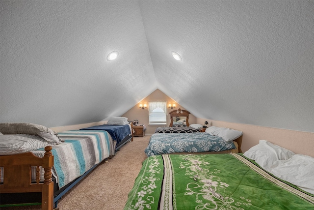 carpeted bedroom with a textured ceiling and lofted ceiling