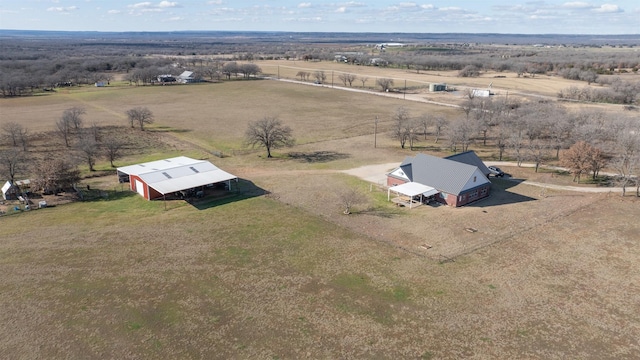 birds eye view of property featuring a rural view