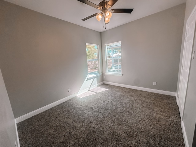 unfurnished bedroom featuring ceiling fan and dark colored carpet