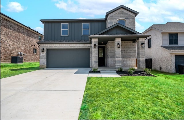 view of front facade featuring an attached garage, central AC, driveway, board and batten siding, and a front yard