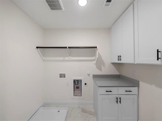 laundry room featuring marble finish floor, cabinet space, visible vents, and hookup for an electric dryer