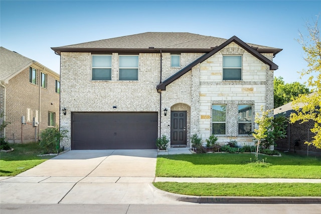 view of front of property with a garage and a front lawn