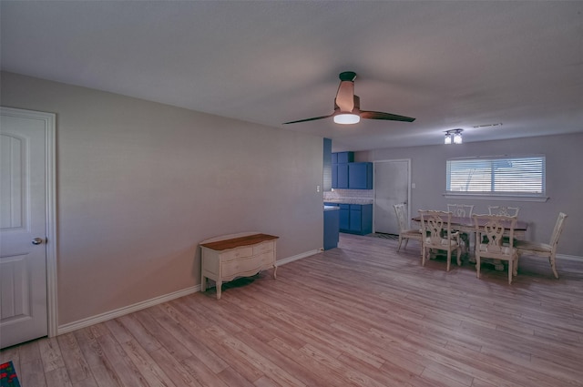 dining space featuring ceiling fan and light hardwood / wood-style floors