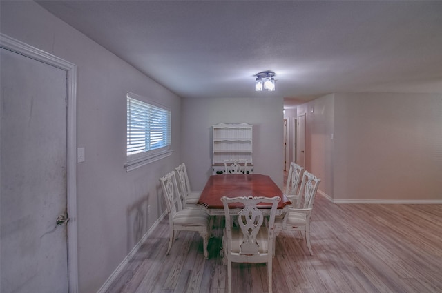 dining room featuring light hardwood / wood-style flooring