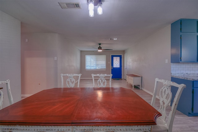 dining space featuring light hardwood / wood-style flooring and ceiling fan