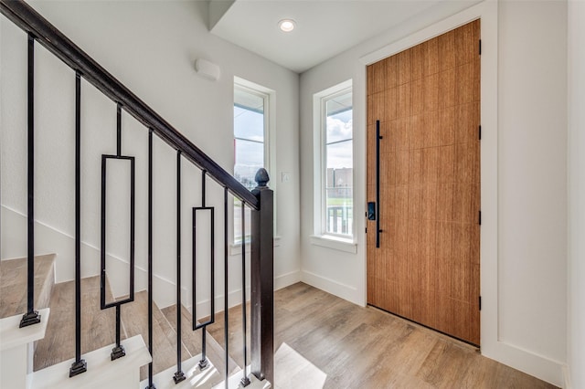 foyer entrance with light hardwood / wood-style floors