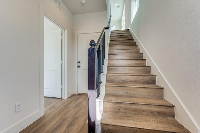 stairway with wood-type flooring