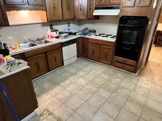 kitchen with sink and white appliances