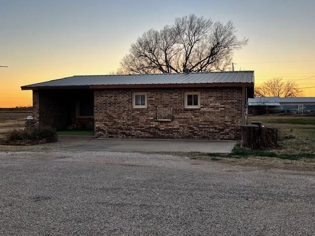 view of property exterior at dusk