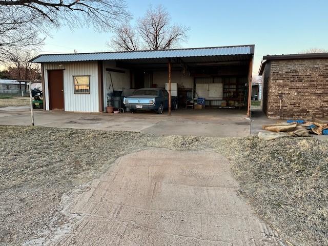 garage featuring a carport