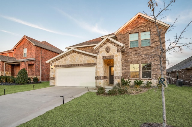 view of property featuring a front lawn and a garage