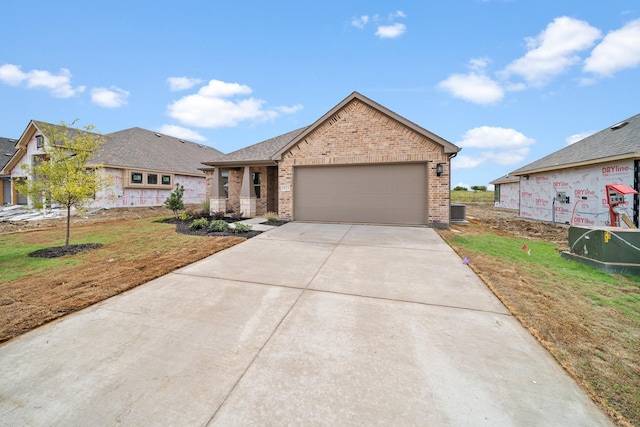 view of front of property with a front yard and a garage