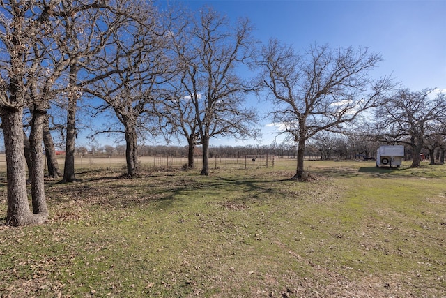 view of yard with a rural view