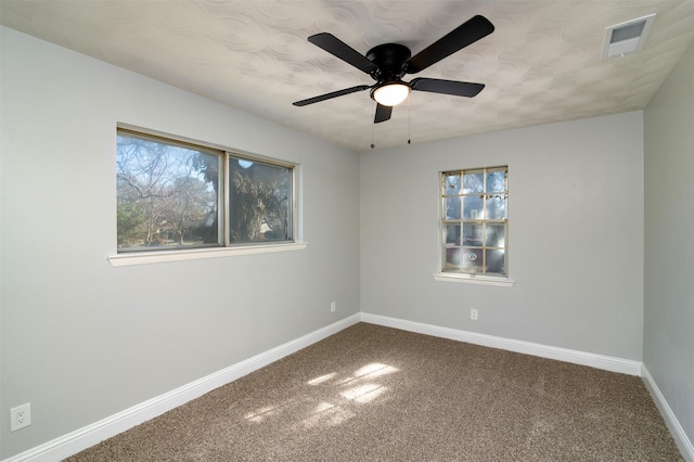 unfurnished room featuring carpet floors and ceiling fan