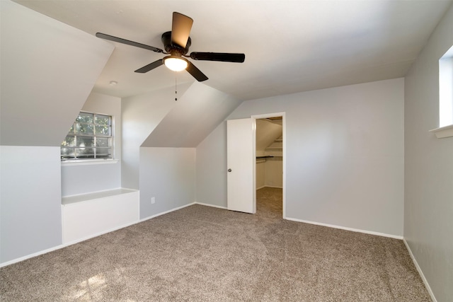 bonus room featuring ceiling fan, carpet floors, and vaulted ceiling