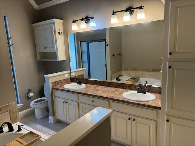 bathroom with ornamental molding, vanity, tile patterned flooring, toilet, and a tub