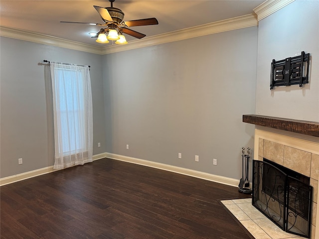 unfurnished living room with crown molding, ceiling fan, light wood-type flooring, a wealth of natural light, and a tiled fireplace