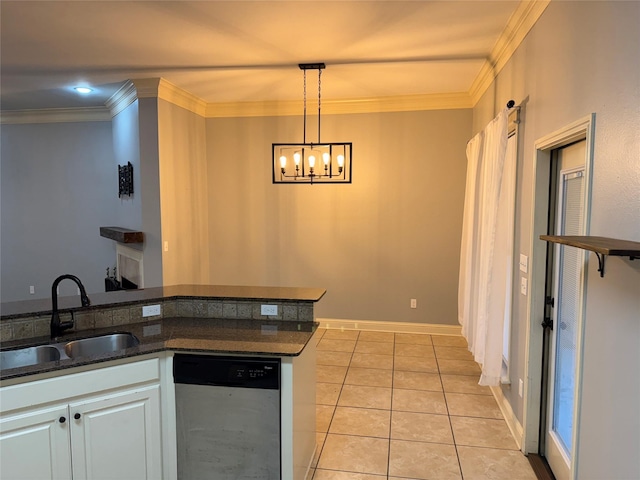 kitchen featuring dishwasher, sink, hanging light fixtures, light tile patterned floors, and white cabinets