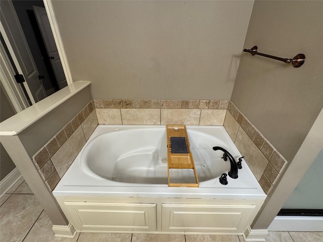 bathroom with tile patterned floors and a bathing tub