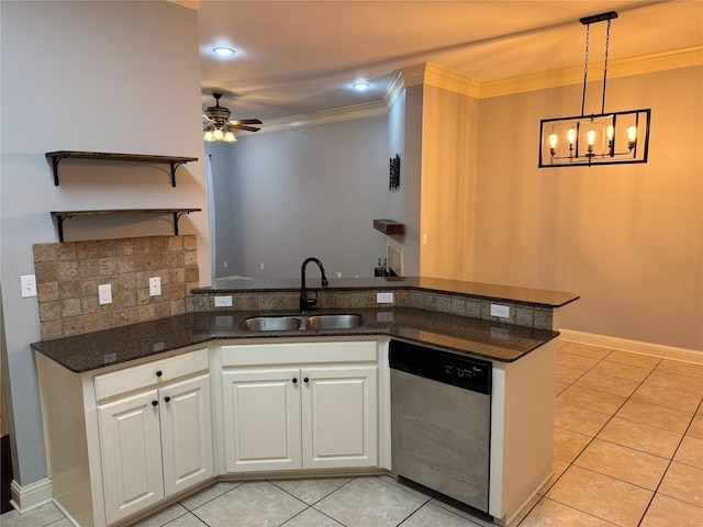 kitchen with ceiling fan with notable chandelier, sink, kitchen peninsula, stainless steel dishwasher, and white cabinetry