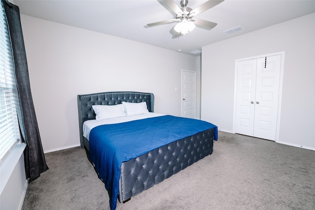 carpeted bedroom with a closet and ceiling fan