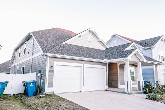 view of front facade featuring covered porch and a garage