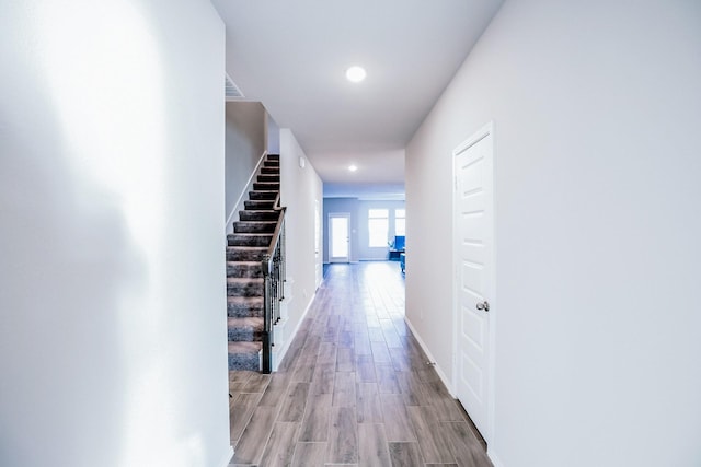 corridor featuring light hardwood / wood-style floors