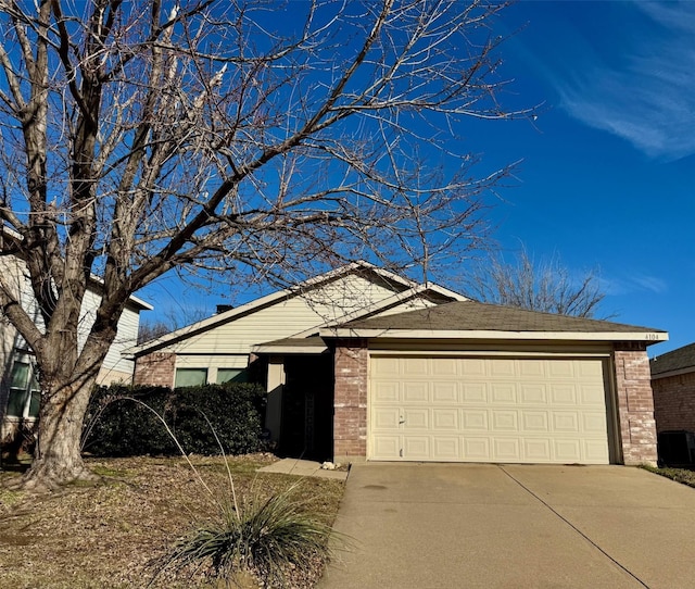 ranch-style home with a garage and central AC unit