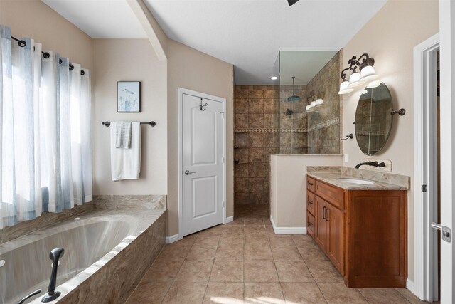 bathroom with tile patterned floors, plus walk in shower, and vanity