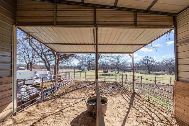 view of yard with a rural view and an outdoor structure