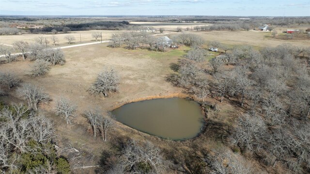 birds eye view of property with a rural view and a water view