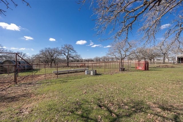 view of yard with a rural view