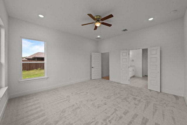 217 Rosemary Dr, Azle, TX 76020 - unfurnished bedroom featuring light colored carpet, baseboards, recessed lighting, ensuite bathroom, and a ceiling fan