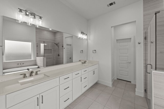 217 Rosemary Dr, Azle, TX 76020 - bathroom featuring a stall shower, double vanity, tile patterned flooring, a bath, and baseboards