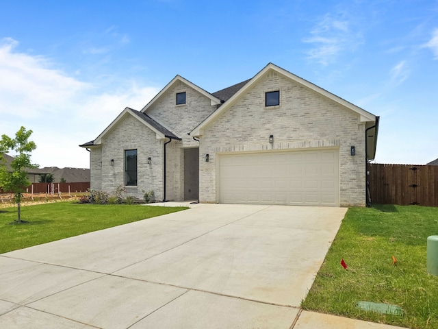 217 Rosemary Dr, Azle, TX 76020 - view of front of property featuring driveway, brick siding, and an attached garage