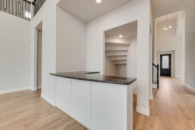 1224 Calebria Way, Fate, TX 75087 - hallway with stairs, light wood-type flooring, baseboards, and recessed lighting