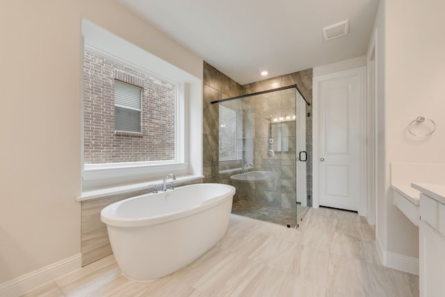 1224 Calebria Way, Fate, TX 75087 - full bath with a freestanding bath, a stall shower, vanity, and baseboards