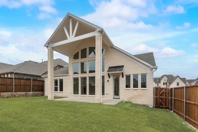 1224 Calebria Way, Fate, TX 75087 - back of house featuring a patio area, brick siding, and a shingled roof