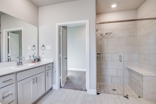 bathroom featuring vanity, tile patterned floors, and walk in shower