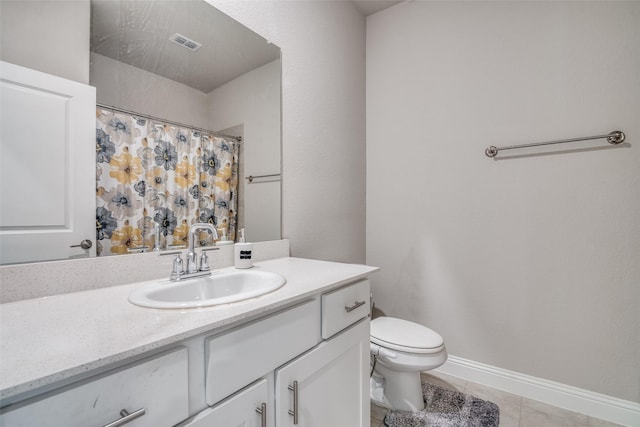 bathroom featuring tile patterned floors, vanity, curtained shower, and toilet