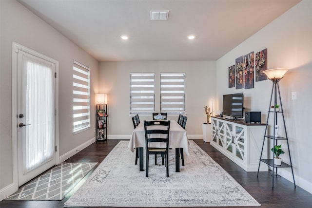 dining area featuring dark hardwood / wood-style floors