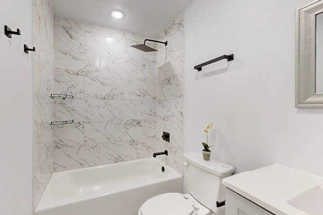 bathroom with tub / shower combination, vanity, and toilet