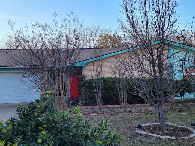 view of property exterior featuring a garage