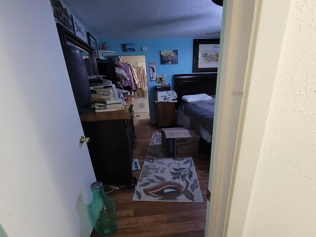 interior space with hardwood / wood-style floors and a textured ceiling