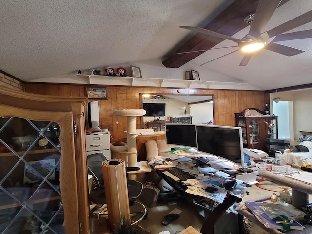 misc room with vaulted ceiling with beams, wood walls, ceiling fan, and a textured ceiling