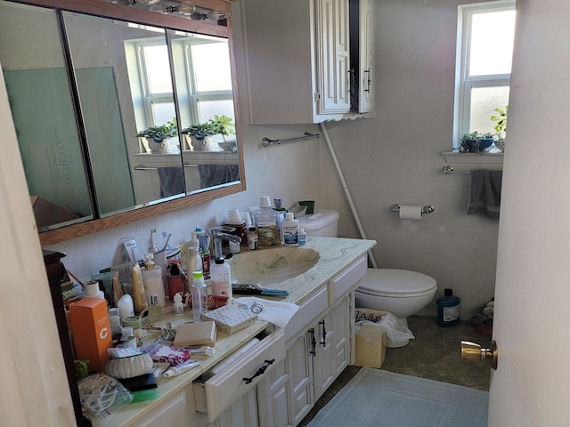 bathroom featuring vanity and toilet