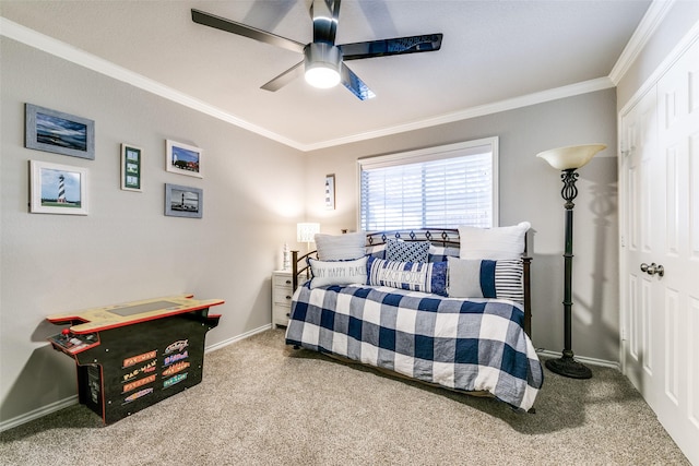 bedroom with carpet flooring, ceiling fan, and ornamental molding