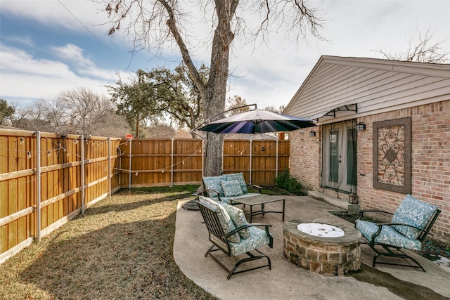 view of patio with a fire pit